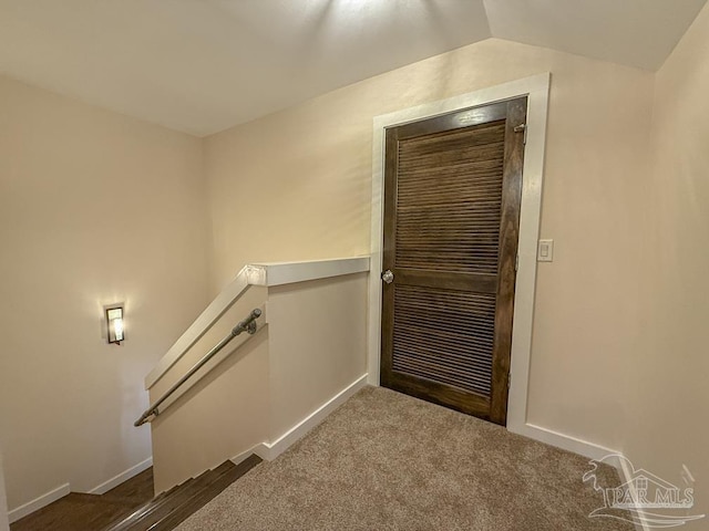 9873 Chumuckla Springs Rd, Jay, FL 32565 - doorway to outside with baseboards, carpet flooring, and lofted ceiling