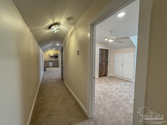 9873 Chumuckla Springs Rd, Jay, FL 32565 - hallway with baseboards, carpet, and vaulted ceiling