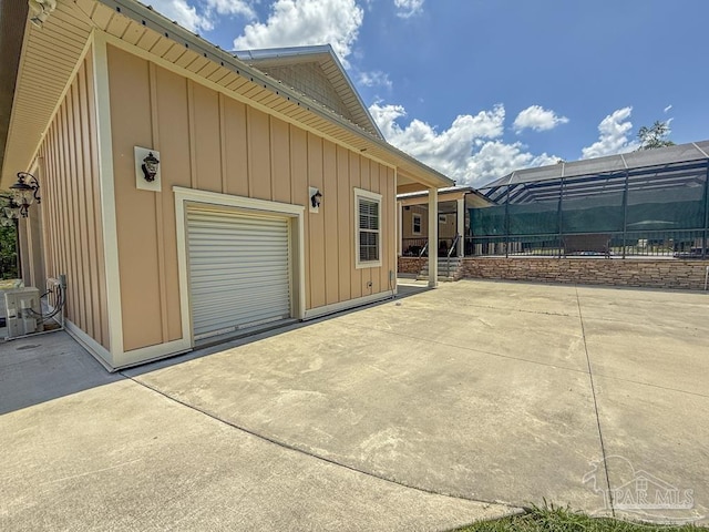 9873 Chumuckla Springs Rd, Jay, FL 32565 - view of side of home with a patio and board and batten siding