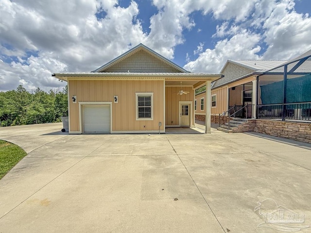 9873 Chumuckla Springs Rd, Jay, FL 32565 - view of front facade with board and batten siding and concrete driveway