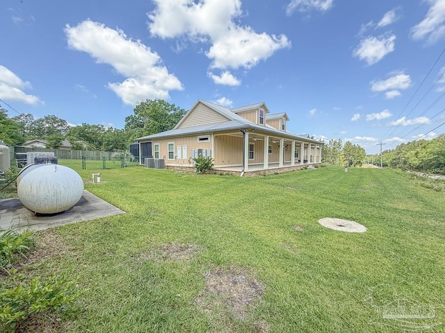 9873 Chumuckla Springs Rd, Jay, FL 32565 - exterior space with a lawn, fence, and covered porch