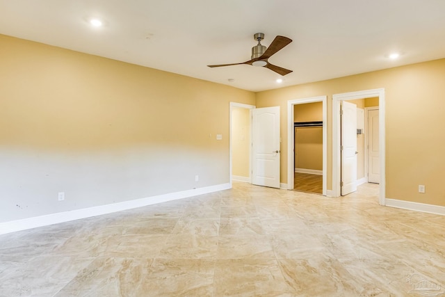 spare room with ceiling fan