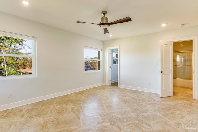 unfurnished room with ceiling fan