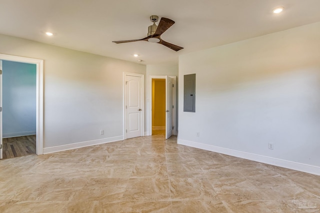 empty room featuring electric panel and ceiling fan