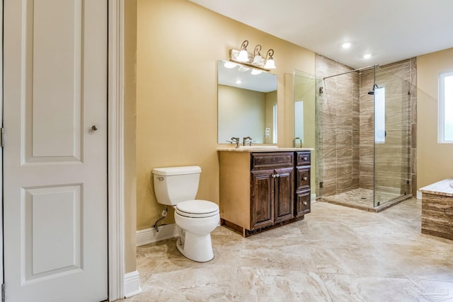 bathroom with toilet, vanity, and walk in shower