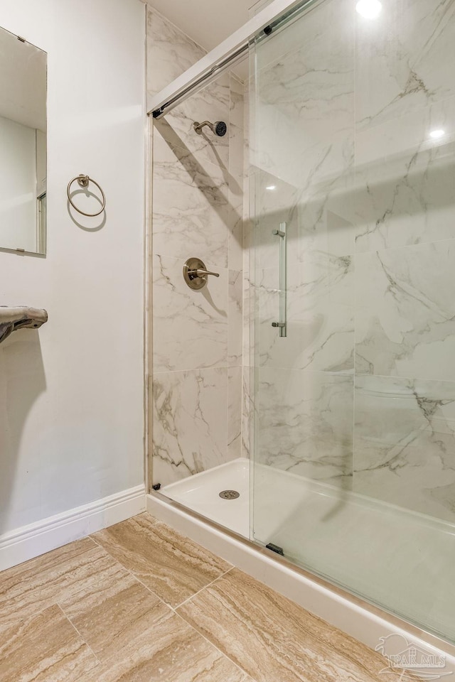 bathroom featuring an enclosed shower