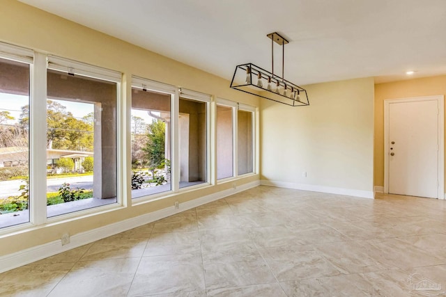 unfurnished dining area featuring a healthy amount of sunlight