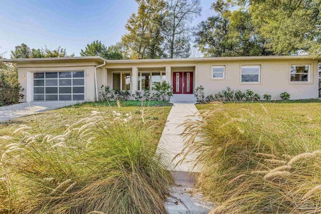 ranch-style home with a garage