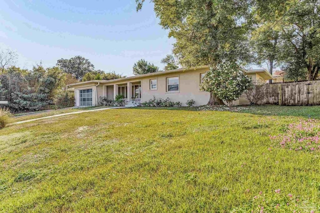 ranch-style house with a front lawn