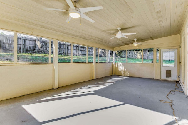 unfurnished sunroom with vaulted ceiling and wood ceiling