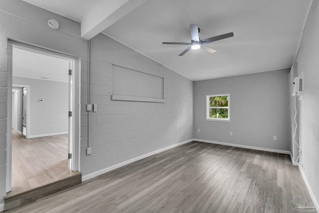 unfurnished room featuring ceiling fan, wood-type flooring, and vaulted ceiling with beams