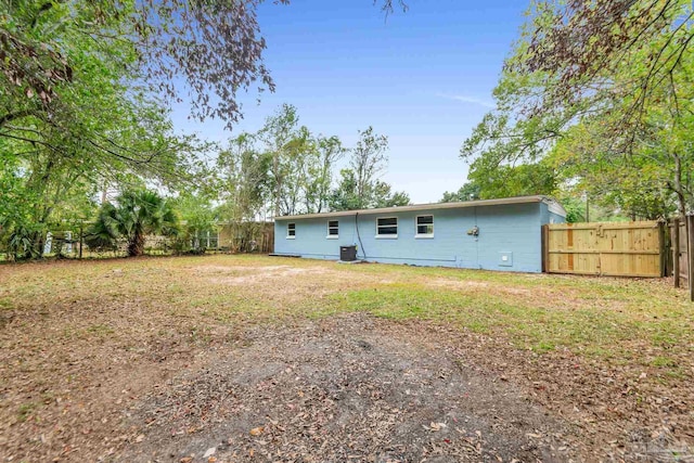 rear view of house featuring cooling unit