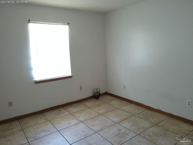 925 Bremen Ave Unit A & B, Pensacola, FL 32507 - spare room featuring healthy amount of natural light, baseboards, and light tile patterned floors