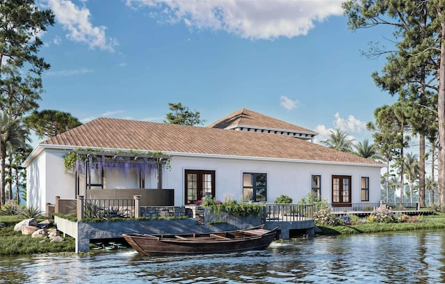 2067 Palmetto Lake Dr, Navarre, FL 32566 - back of property with stucco siding, french doors, and a deck with water view