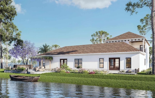 2067 Palmetto Lake Dr, Navarre, FL 32566 - rear view of house with stucco siding, a water view, and french doors