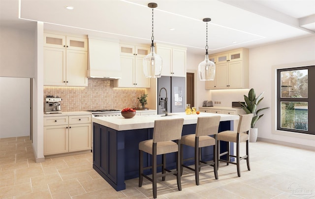 2067 Palmetto Lake Dr, Navarre, FL 32566 - kitchen featuring a kitchen bar, an island with sink, light countertops, decorative backsplash, and custom exhaust hood