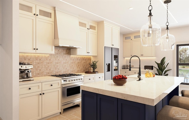 2067 Palmetto Lake Dr, Navarre, FL 32566 - kitchen with stainless steel appliances, tasteful backsplash, a breakfast bar, a kitchen island with sink, and custom range hood