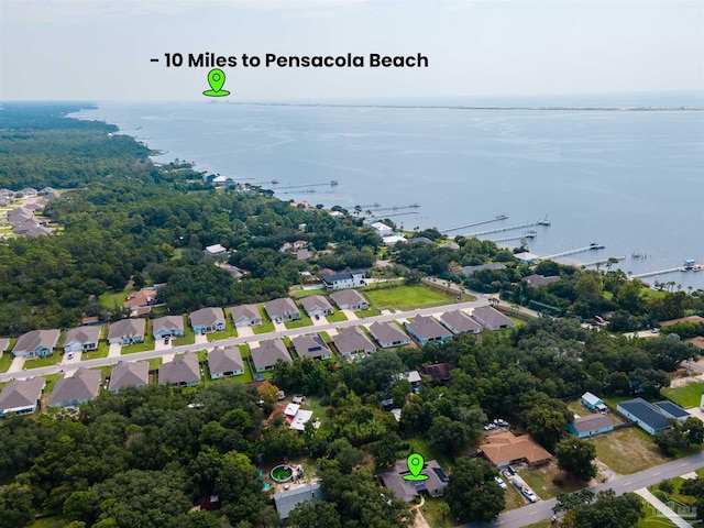 bird's eye view featuring a water view and a residential view