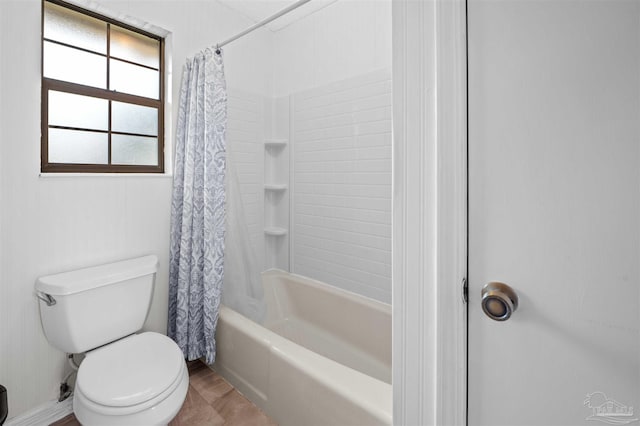 bathroom with toilet and shower / bath combo with shower curtain