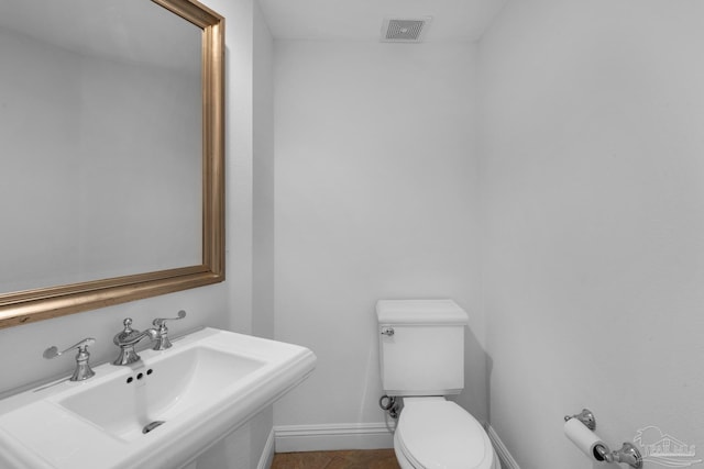 bathroom with sink and toilet