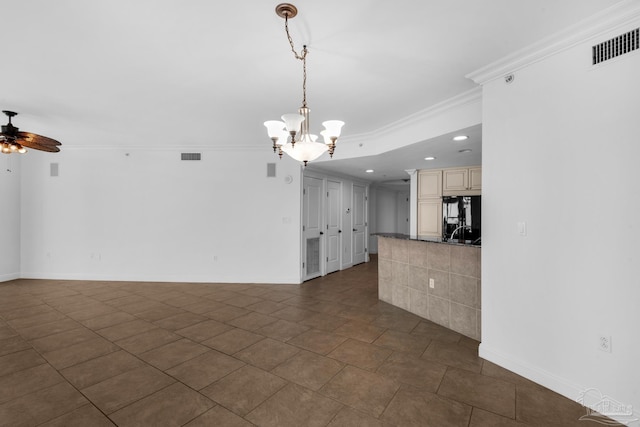 interior space with ceiling fan with notable chandelier and ornamental molding