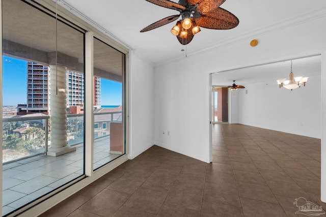 tiled spare room featuring ceiling fan with notable chandelier and crown molding