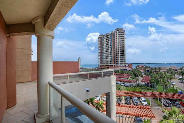 balcony featuring a water view