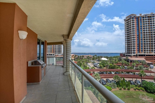 balcony featuring a water view