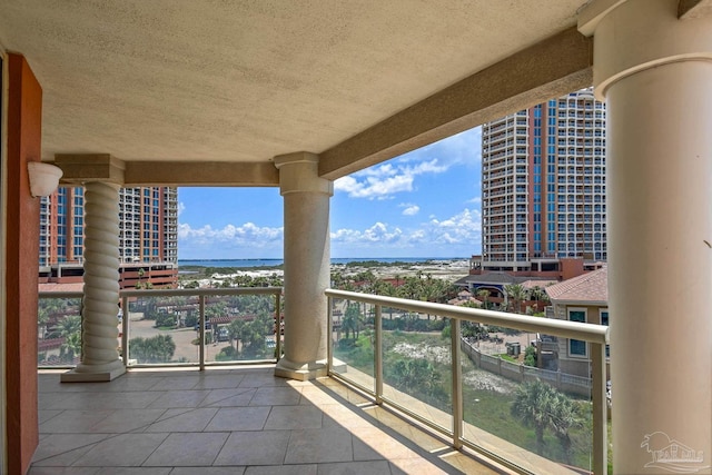 balcony featuring a water view