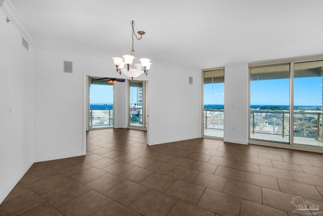 spare room featuring floor to ceiling windows, an inviting chandelier, and ornamental molding