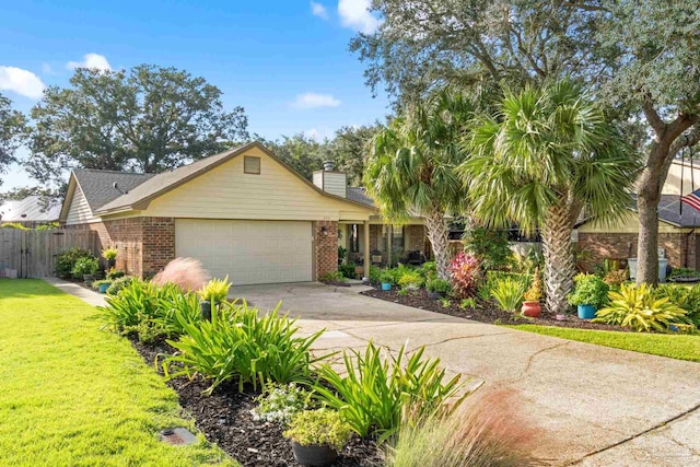 view of front of property featuring a front yard and a garage