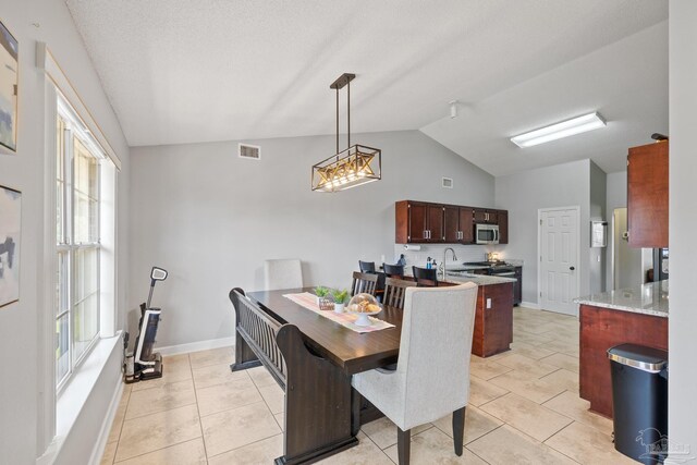 1307 Mazurek Blvd, Pensacola, FL 32514 - dining room with lofted ceiling, baseboards, and light tile patterned floors