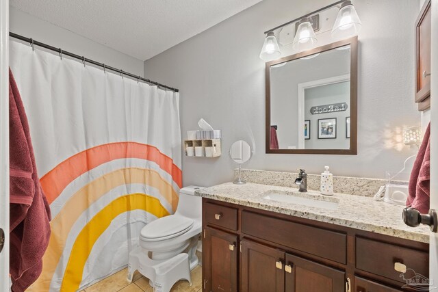 1307 Mazurek Blvd, Pensacola, FL 32514 - full bath with vanity, toilet, tile patterned flooring, and curtained shower