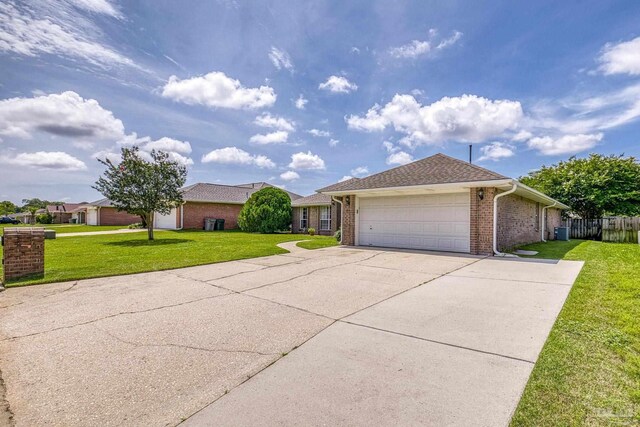 1307 Mazurek Blvd, Pensacola, FL 32514 - single story home featuring a garage, concrete driveway, brick siding, and central AC
