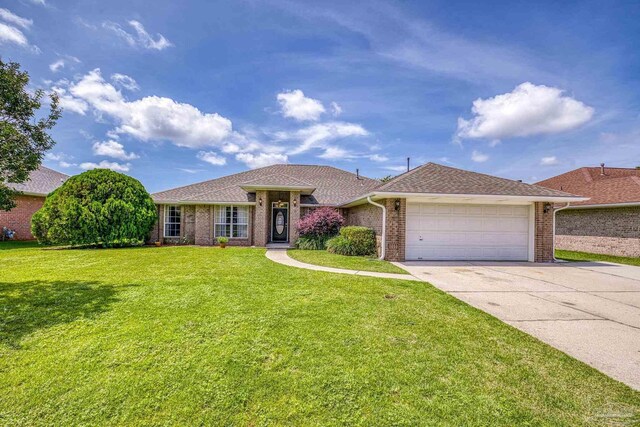 1307 Mazurek Blvd, Pensacola, FL 32514 - ranch-style house with an attached garage, concrete driveway, brick siding, and a front lawn