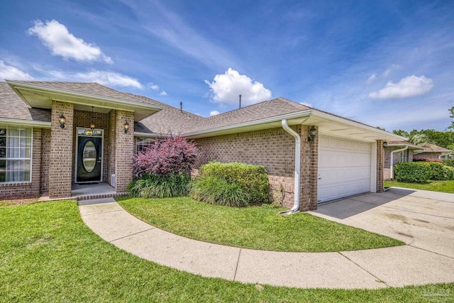 1307 Mazurek Blvd, Pensacola, FL 32514 - ranch-style house featuring brick siding, an attached garage, concrete driveway, a front yard, and roof with shingles