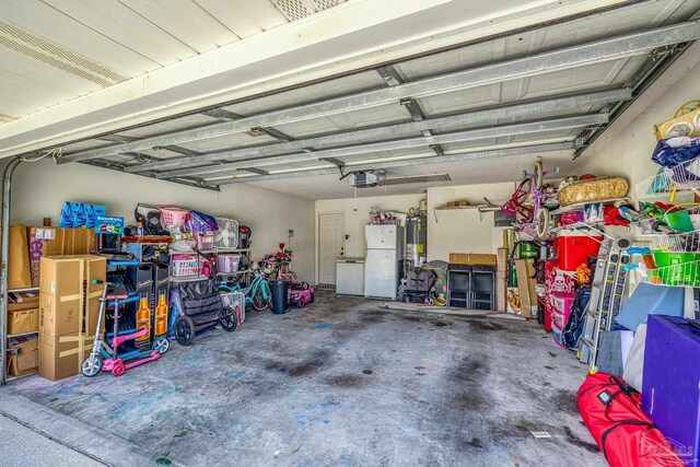 1307 Mazurek Blvd, Pensacola, FL 32514 - garage with freestanding refrigerator, a garage door opener, and water heater