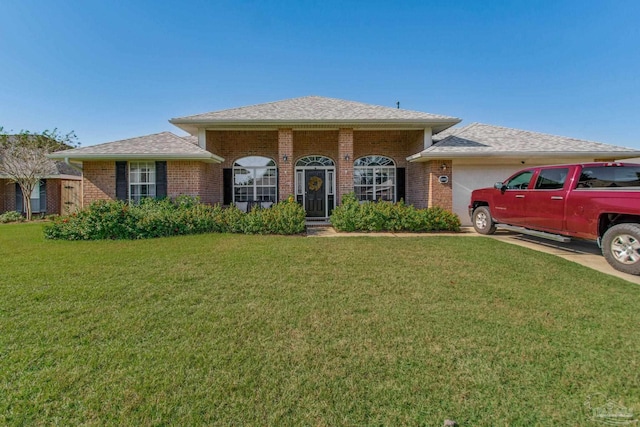 view of front facade with a garage and a front lawn