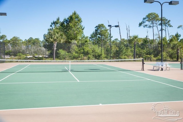 view of tennis court featuring basketball court