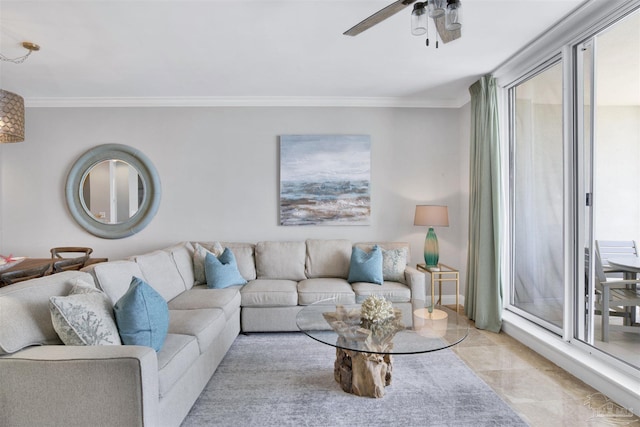 living room featuring ornamental molding, a healthy amount of sunlight, and ceiling fan