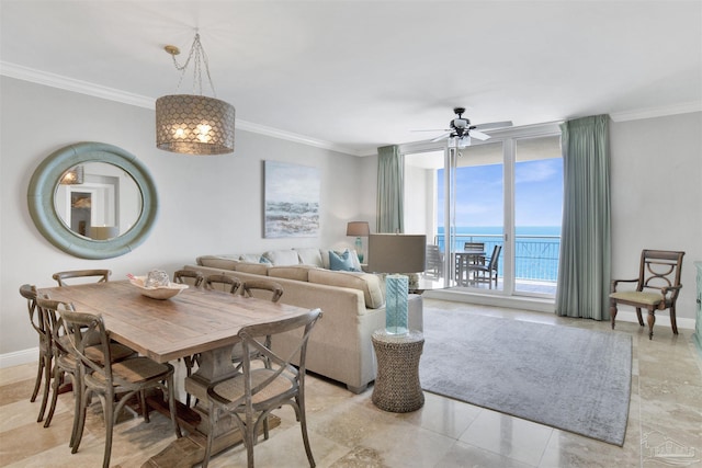 dining space with expansive windows, crown molding, a water view, and ceiling fan