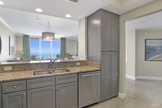 kitchen featuring gray cabinetry, sink, stainless steel dishwasher, and light stone countertops