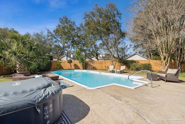 view of pool with a fenced backyard, a patio area, a grill, and a fenced in pool