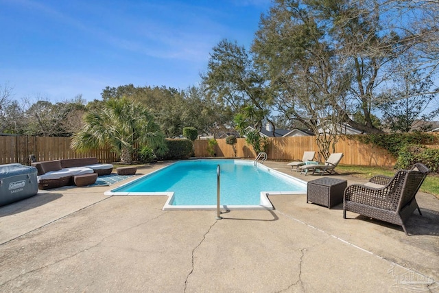 view of pool featuring a fenced backyard, a fenced in pool, and a patio