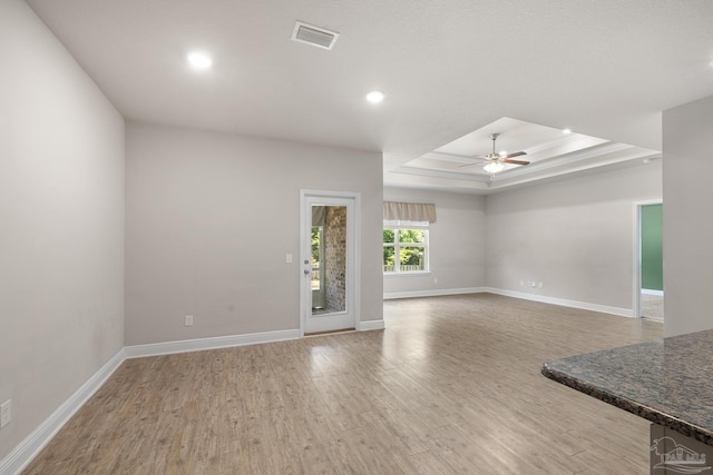 3526 Whitetail Ln, Pensacola, FL 32526 - unfurnished living room featuring ceiling fan, wood finished floors, a raised ceiling, baseboards, and recessed lighting