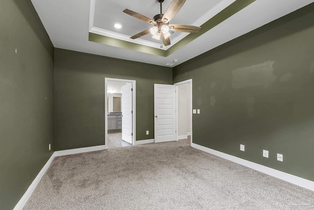 3526 Whitetail Ln, Pensacola, FL 32526 - unfurnished bedroom featuring a tray ceiling, crown molding, carpet, baseboards, and connected bathroom