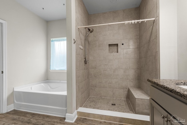 3526 Whitetail Ln, Pensacola, FL 32526 - full bathroom featuring wood finished floors, vanity, a garden tub, and tiled shower