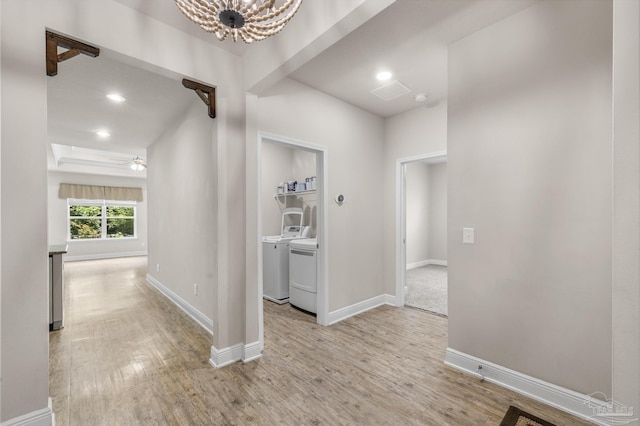 3526 Whitetail Ln, Pensacola, FL 32526 - hallway featuring light wood-style flooring, washer and dryer, baseboards, a chandelier, and recessed lighting