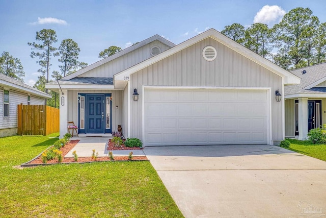 single story home with an attached garage, driveway, fence, and a front yard