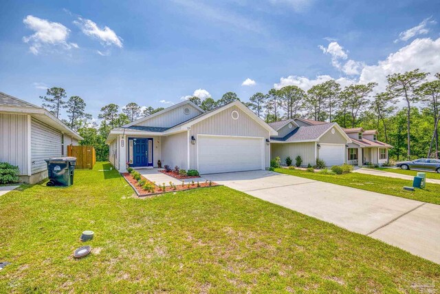 single story home featuring a garage and a front yard